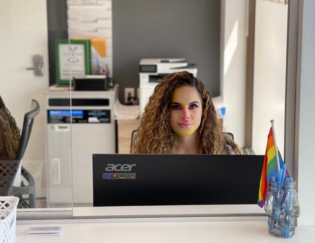 A patient care associate in our Hamden office wearing rainbow makeup.
